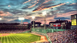 A Baseball Stadium With A Beautiful Sunset Wallpaper