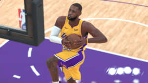 A Basketball Player Is Dribbling In A Game Wallpaper