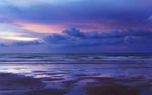 A Beach With A Blue Sky Wallpaper