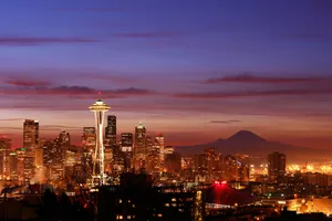 A Beautiful Aerial View Of Seattle, The Emerald City, From A Distance Wallpaper