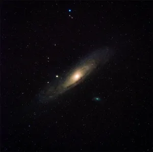 A Beautiful Black And Brown Galaxy In The Night Sky Wallpaper