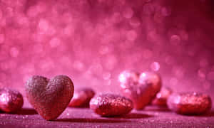 A Beautiful Display Of Glittery Pink Hearts Wallpaper