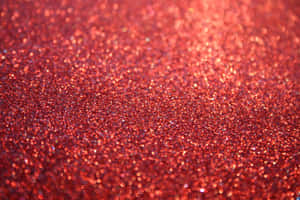 A Beautiful, Eye-catching Glimmer Of Orange Glitter Wallpaper