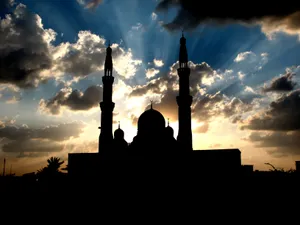 A Beautiful Nighttime Silhouette Of An Islamic Mosque. Wallpaper