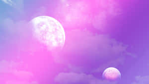 A Beautiful Pink Moon Visible In The Night Sky Wallpaper