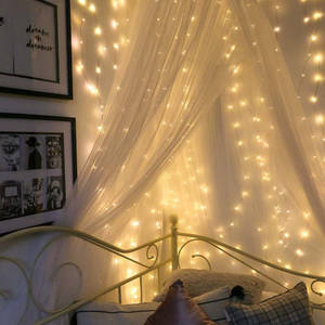 A Beautiful Room Lit Up In A Festive, Fairy Lights Aesthetic. Wallpaper