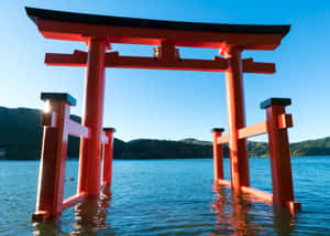 A Beautiful Shinto Shrine In Japan Immersed In Nature Wallpaper