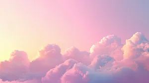 A Beautiful Sky Filled With Soft Pastel-colored Clouds, Illuminated By Warm Sunset Light Wallpaper