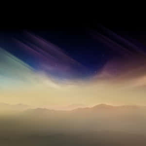 A Beautiful Sky With Clouds And Mountains Wallpaper