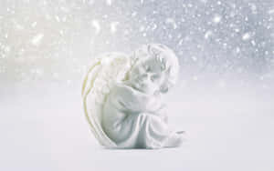 A Beautiful Snow Angel In Winter Wonderland Wallpaper