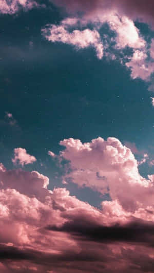 A Beautiful Sunrise Reveals The Gorgeous Hues Of Pink, Purple And Blue In The Clouds. Wallpaper