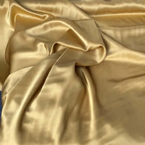 A Beautiful Warm-looking Fabric In Shades Of Gold And Yellow. Wallpaper