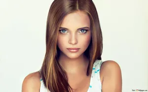 A Beautiful Woman With Brown Hair And Blue Eyes Wallpaper