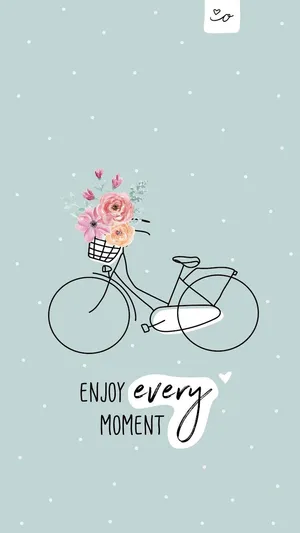 A Bicycle With Flowers In A Basket And The Words Enjoy Every Moment Wallpaper
