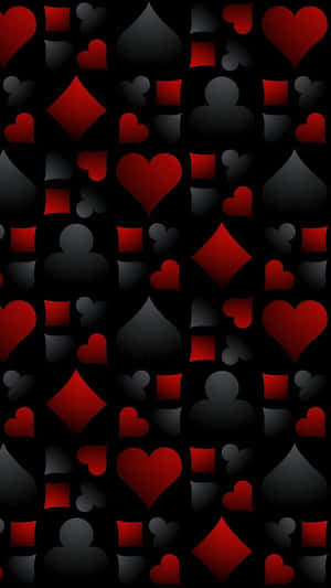 A Black And Red Pattern With Hearts And Cards Wallpaper