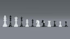 A Black And White Chess Game In Progress Wallpaper