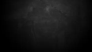 A Black And White Image Of A Black Wall Wallpaper