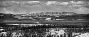 A Black And White Photo Of A Mountain Range Wallpaper