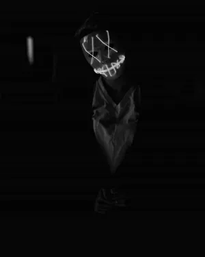 A Black And White Photo Of A Person With A Mask Wallpaper