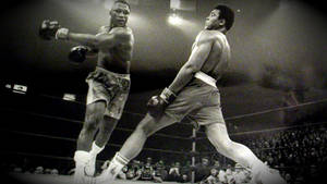 A Black And White Photo Of Two Boxers Fighting Wallpaper