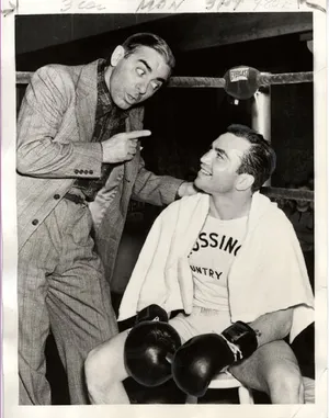 A Black And White Photo Of Two Men In Boxing Gloves Wallpaper