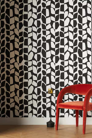 A Black And White Wallpaper With A Red Chair Wallpaper