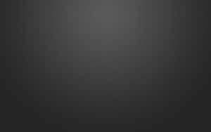 A Black Background With A Light Texture Wallpaper