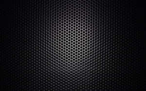 A Black Background With A Metal Grille Wallpaper