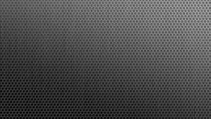 A Black Background With A Pattern Of Hexagons Wallpaper