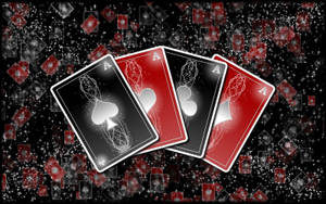A Black Background With Playing Cards On It Wallpaper