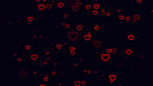 A Black Background With Red Hearts On It Wallpaper