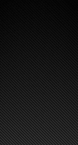 A Black Carbon Fiber Background With A Black Background Wallpaper