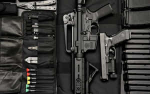 A Black Case With Several Guns And Accessories Wallpaper