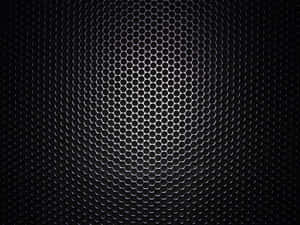 A Black Metal Grille With Holes In It Wallpaper