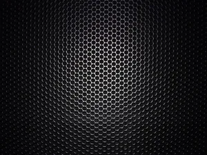 A Black Metal Grille With Holes In It Wallpaper