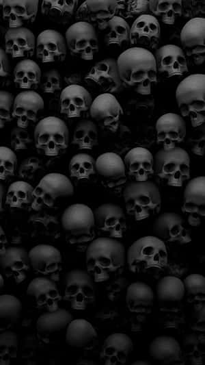 A Black Skull Wall With Many Skulls In It Wallpaper