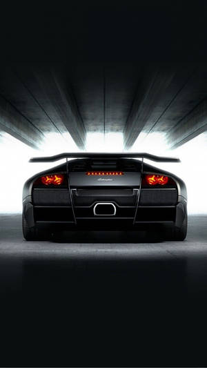 A Black Sports Car In A Dark Tunnel Wallpaper