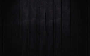 A Black Wooden Background With A Dark Background Wallpaper