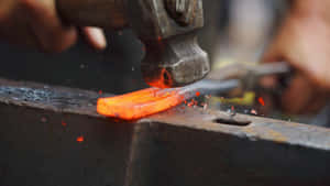 A Blacksmith Hard At Work Wallpaper