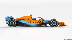 A Blue And Orange Racing Car Is Shown Wallpaper