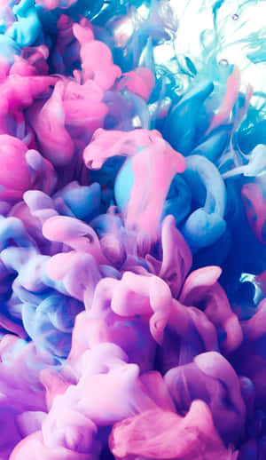 A Blue And Pink Liquid Is Floating In The Air Wallpaper