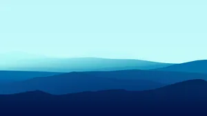 A Blue And White Mountain Landscape With A Blue Sky Wallpaper