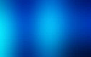 A Blue Desktop Illuminated With Natural Light Wallpaper