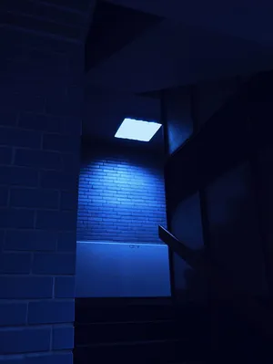 A Blue Light Is Shining On A Brick Wall Wallpaper