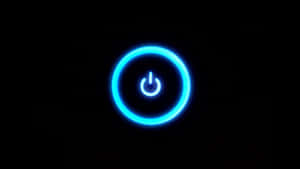 A Blue Light Is Shown On A Black Background Wallpaper