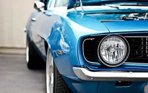 A Blue Muscle Car With The Hood Open Wallpaper