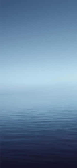 A Blue Ocean With A White Horizon Wallpaper