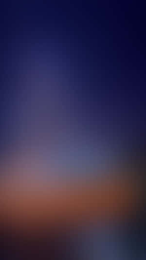 A Blurred Background With A Blue Sky And A Sunset Wallpaper