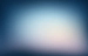 A Blurred Blue Background With A Light Blue Sky Wallpaper