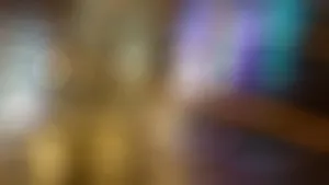 A Blurry Background With A Light Shining On It Wallpaper